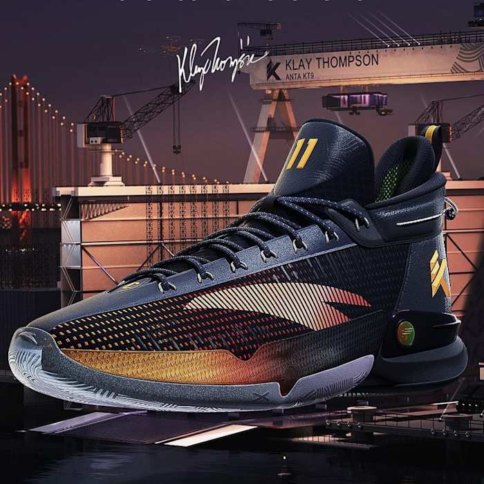 Side view of Klay Thompson's black and gold ANTA basketball shoe.